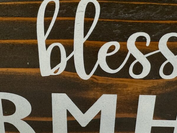 rustic sign made of cedar fence pickets that reads bless our farmhouse