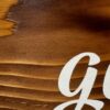 an Early American stained rustic sign made of cedar fence pickets that reads Give it to God and Go to Sleep
