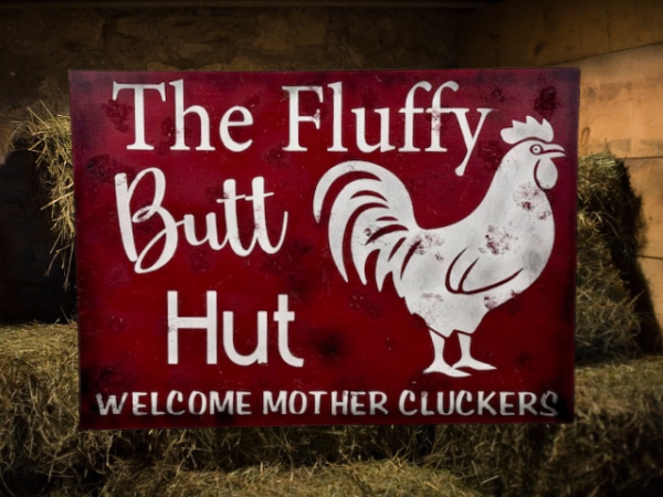 rustic sign with a red sawdust-textured background, featuring a chicken illustration and the text 'Fluffy Butt Hut - Welcome Mother Cluckers'