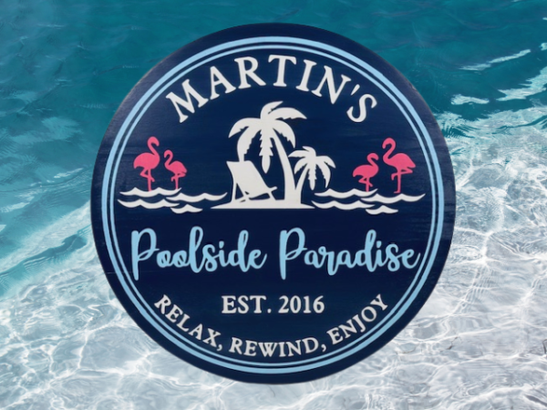 customizable deep blue round wood pool sign that reads 'Poolside Paradise - Relax, Rewind, Enjoy