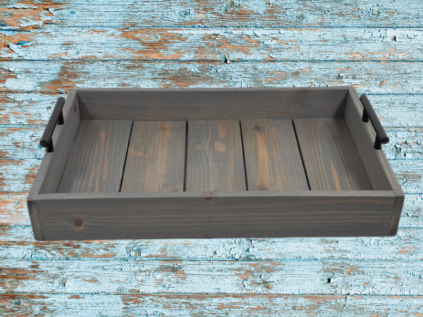 rustic gray serving tray that has been torched and then stained in weathered gray; black handles on both sides finish off this charming tray