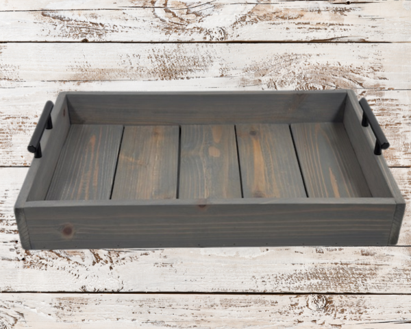 rustic gray serving tray that has been torched and then stained in weathered gray; black handles on both sides finish off this charming tray