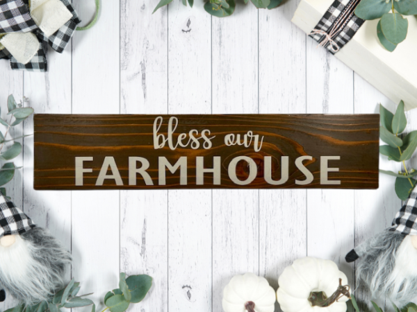 rustic sign made of cedar fence pickets that reads bless our farmhouse