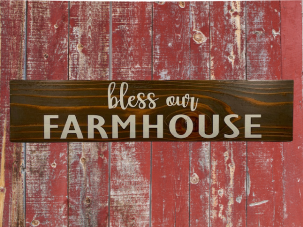 rustic sign made of cedar fence pickets that reads bless our farmhouse