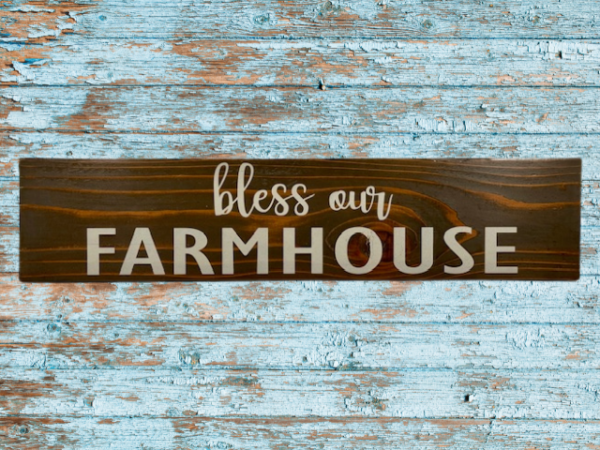 rustic sign made of cedar fence pickets that reads bless our farmhouse