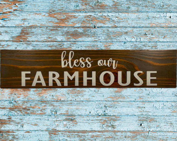 rustic sign made of cedar fence pickets that reads bless our farmhouse