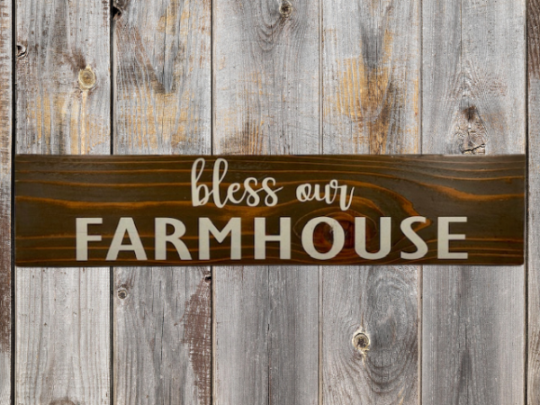 rustic sign made of cedar fence pickets that reads bless our farmhouse