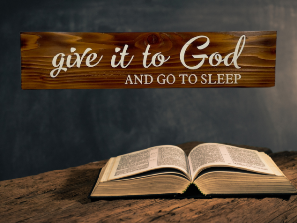 an Early American stained rustic sign made of cedar fence pickets that reads Give it to God and Go to Sleep