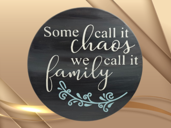 charming and elegant wood round sign that reads some call it chaos we call it family; colors are barnwood stain with ivory and light blue lettering