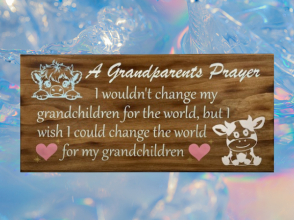 beautiful lightly brown stained sign that is titled A Grandparents Prayer - and reads "I wouldn't change my grandchildren for the world but I wish I could change the world for my grandchildren - in pastel colors