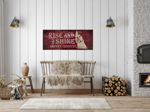 distressed and rustic red background sign with silver chicken wire - signs reads Rise and Shine Mother Cluckers