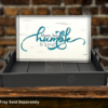 Serving tray insert - white background with dark gray and teal wording that says Always stay humble and kind
