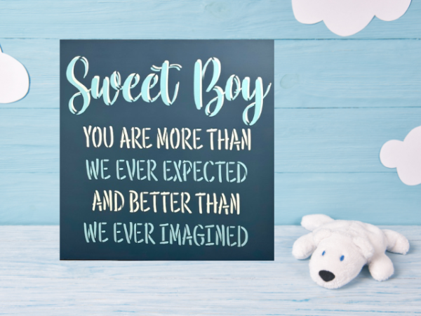 Dark blue, light blue and white baby boy nursery sign that is titled "sweet boy"