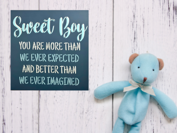 Dark blue, light blue and white baby boy nursery sign that is titled "sweet boy"