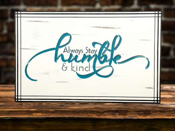 Serving tray insert - white background with dark gray and teal wording that says Always stay humble and kind