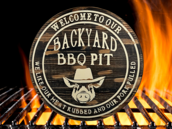 wood round pine rustic BBQ sign that reads Welcome to our Backyard BBQ - we like our meat rubbed and our pork pulled