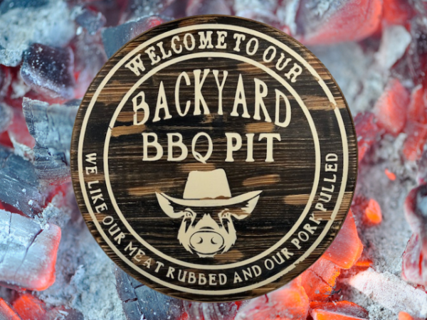 wood round pine rustic BBQ sign that reads Welcome to our Backyard BBQ - we like our meat rubbed and our pork pulled