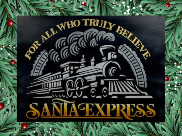 Christmas sign featuring a black background with the words For All Who Truly Believe The Santa Express painted in orange, yellow, and white ombre letters surrounding a white Christmas train