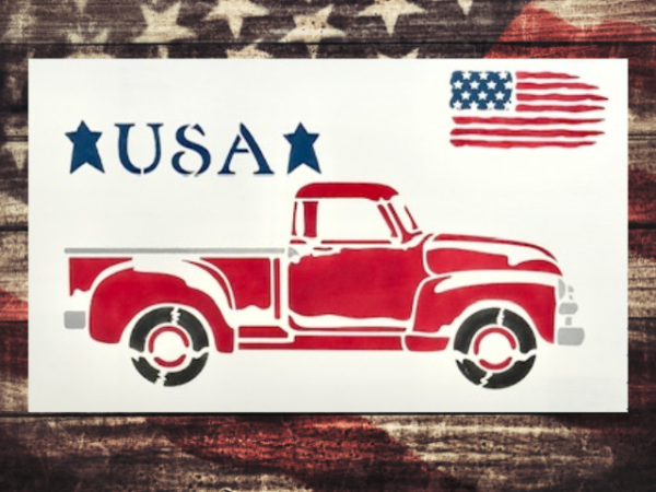 patriotic and vintage sign featuring an old red truck with the words "USA" and a USA flag above the truck sitting on a crisp white background