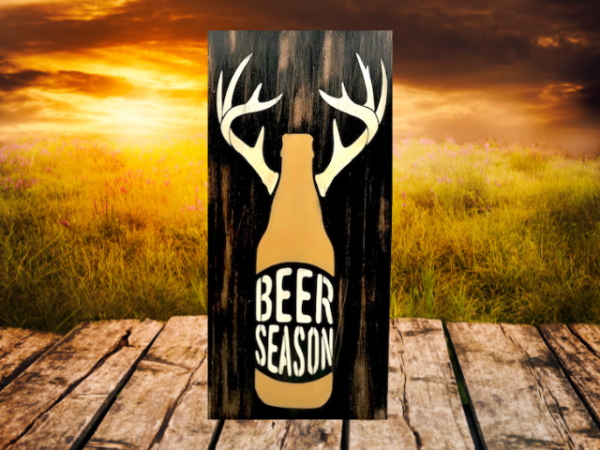 rustic and distressed hunting sign that has a beer bottle with antlers and reads "Beer Season"