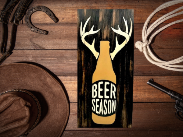 rustic and distressed hunting sign that has a beer bottle with antlers and reads "Beer Season"