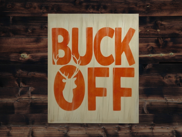 rustic tan hunting sign with orange letters that says "Buck Off