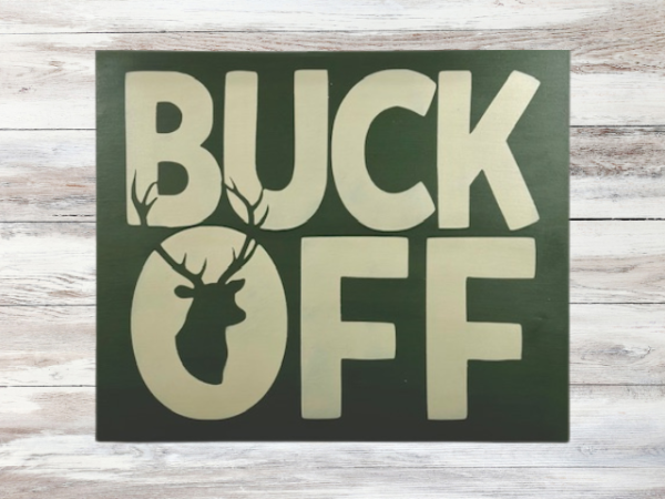 rustic tan hunting sign with orange letters that says "Buck Off