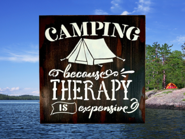 witty camping sign that is distressed and painted in black, brown, and tan - sign reads "Camping because therapy is expensive"