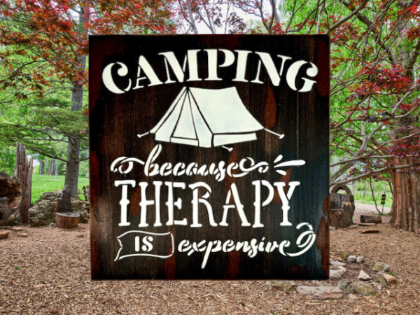 witty camping sign that is distressed and painted in black, brown, and tan - sign reads "Camping because therapy is expensive"