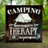 witty camping sign that is distressed and painted in black, brown, and tan - sign reads "Camping because therapy is expensive"