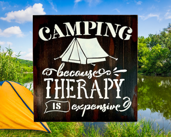 witty camping sign that is distressed and painted in black, brown, and tan - sign reads "Camping because therapy is expensive"