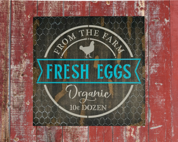 brown rustic and distressed sign with vibrant teal and tan lettering - sign says Fresh Eggs from the Farm