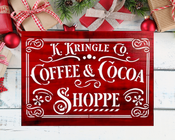 beautiful Christmas sign with a red and black background and sharp white lettering that says K. Kringle Co Coffee & Cocoa