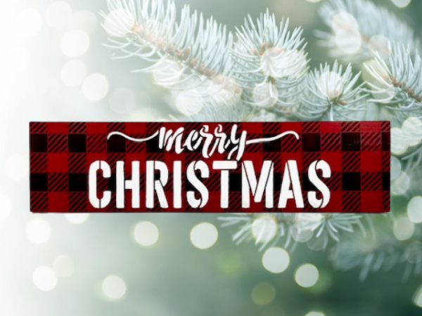 festive Christmas sign with black and red plaid background and the worlds "Merry Christmas" centered in bold white cursive lettering