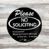 Please No Soliciting pine wood round sign that says Please No Soliciting - It's not personal, we just dont want to talk to you, or hear you, or see you. Black background and crisp white lettering finish off this cheerful sign