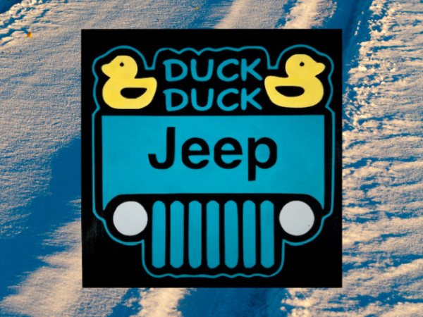 sign with a black background and teal jeep that has two bright yellow ducks in the corners