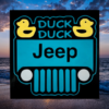 sign with a black background and teal jeep that has two bright yellow ducks in the corners