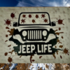 Rugged and muddy Jeep sign - Jeep is black with mud all over the windshield and roadway, sign says Jeep Life