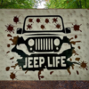 Rugged and muddy Jeep sign - Jeep is black with mud all over the windshield and roadway, sign says Jeep Life
