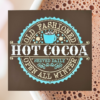 warm and cozy Christmas sign with a brown background and snowy blue and white lettering that says "Old Fashioned Hot Cocoa"