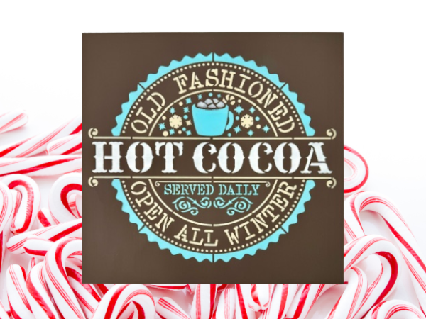 warm and cozy Christmas sign with a brown background and snowy blue and white lettering that says "Old Fashioned Hot Cocoa"