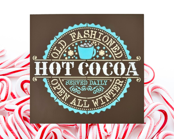 warm and cozy Christmas sign with a brown background and snowy blue and white lettering that says "Old Fashioned Hot Cocoa"