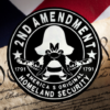 beautiful deep black pine round sign that reads "2nd Amendment - America's Original Homeland Security" in crisp white lettering