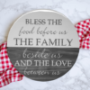 beautiful round lazy susan in two-toned Weathered Gray stain and Silver Lining paint - protected in epoxy coating - reads "Bless the food before us, the family beside us and the love between us"