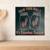 funny kitchen sign that says "Grab Your Balls It's Canning Season" with 2 iconic Ball Jars in the middle of the sign