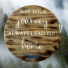 stunning pine wood lazy Susan - wood has been torched, stained in Dark Walnut and painted Ivory lettering that reads "May Your Journey Always Lead You Home" - finished in epoxy resin