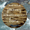 stunning pine wood lazy Susan - wood has been torched, stained in Dark Walnut and painted Ivory lettering that reads "May Your Journey Always Lead You Home" - finished in epoxy resin
