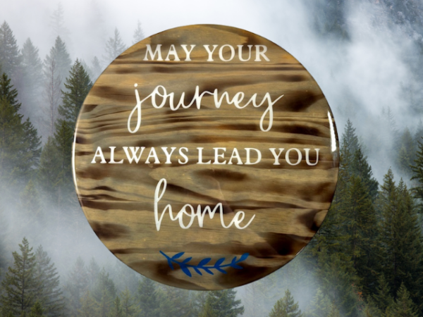 stunning pine wood lazy Susan - wood has been torched, stained in Dark Walnut and painted Ivory lettering that reads "May Your Journey Always Lead You Home" - finished in epoxy resin