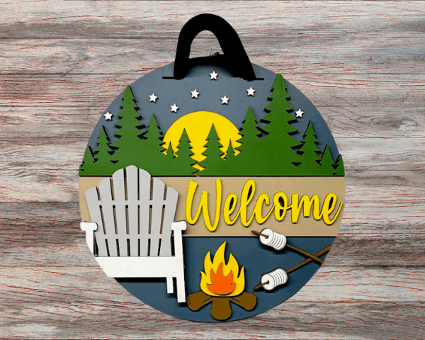 3D laser-cut wooden welcome sign with campfire, camping chairs, pine trees, and moonlight night scene