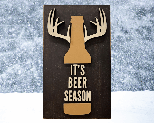 3D laser cut deer hunting beer sign with antlers and distressed brown background